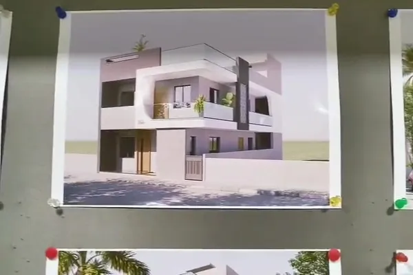 Wall of project designs at the Sharda Engineers office