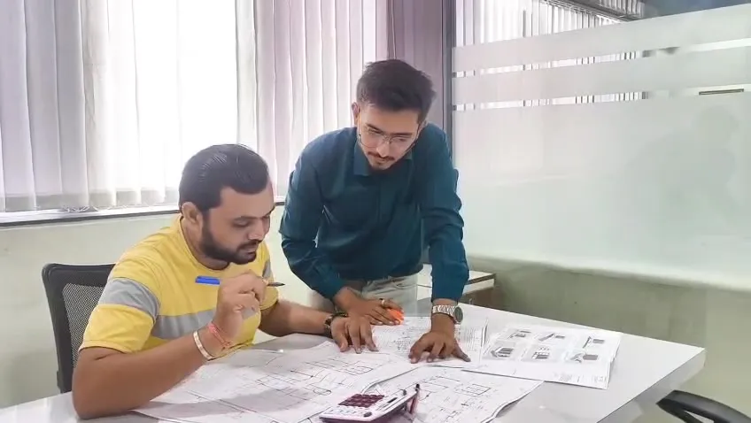 Sharda Engineers site team reviewing RCC drawings